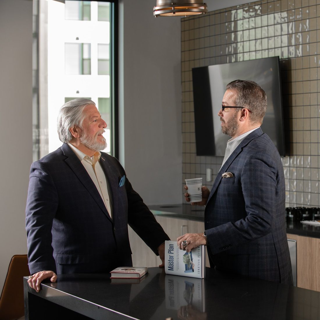 Jon Peyton, founder of C-Suite Planning, with a colleague